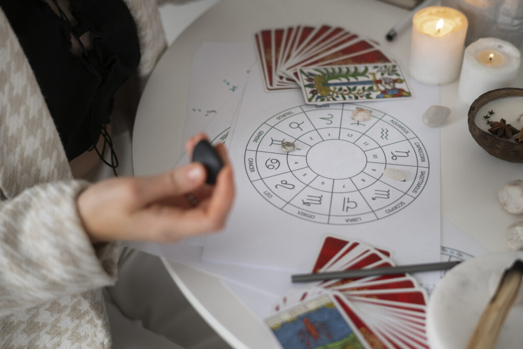 Multi-Astrologer App Development Company high angle woman reading tarot home